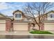Charming townhome with a two-car garage and beautifully maintained front yard at 3179 S Indiana St, Lakewood, CO 80228