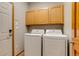 Convenient laundry room featuring modern white washer and dryer at 3179 S Indiana St, Lakewood, CO 80228