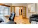 Home office with hardwood floors, double doors, and natural light at 3179 S Indiana St, Lakewood, CO 80228
