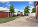 Backyard featuring turf, sheds, seating and partial fence surround at 805 5Th St, Fort Lupton, CO 80621