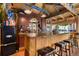 Interior of bar with stools, kitchenette, lights and decorations at 805 5Th St, Fort Lupton, CO 80621
