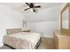 Cozy bedroom features an overhead fan, neutral decor, and a comfortable-looking bed at 805 5Th St, Fort Lupton, CO 80621