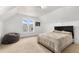 Comfortable bedroom with a bed, beanbag chair, and window at 805 5Th St, Fort Lupton, CO 80621