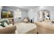 Bright living room with neutral walls, hardwood floors, and comfortable seating arrangement at 805 5Th St, Fort Lupton, CO 80621