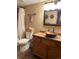 Cozy bathroom featuring a vessel sink, wood vanity, and bathtub with shower, creating a relaxing space at 17046 Wellington Dr, Parker, CO 80134