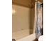 Bathtub and shower with shower curtain rod at 17046 Wellington Dr, Parker, CO 80134