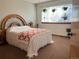 Bedroom featuring a large window and hanging plants creates a peaceful and inviting atmosphere at 17046 Wellington Dr, Parker, CO 80134
