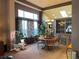 Bright dining room with large windows and a view into the kitchen at 17046 Wellington Dr, Parker, CO 80134
