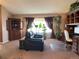 Open-concept living room with plenty of natural light and room for entertaining at 17046 Wellington Dr, Parker, CO 80134