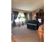 Bright living room with plush carpet, large windows, and comfortable seating at 17046 Wellington Dr, Parker, CO 80134