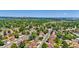 A beautiful, lush neighborhood offers a serene setting with mature trees shading the homes at 6441 W 73Rd Pl, Arvada, CO 80003