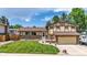Charming home with a manicured lawn, brick accents, and a two-car garage at 6441 W 73Rd Pl, Arvada, CO 80003