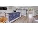 Open concept living room with bar seating and view of the kitchen at 6441 W 73Rd Pl, Arvada, CO 80003