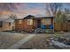 Charming brick home featuring a well-maintained front yard with colorful sky at dusk at 3258 Niagara St, Denver, CO 80207