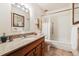 Standard bathroom featuring a bath tub with shower, granite countertop and traditional cabinets at 715 S Alton Way # 5D, Denver, CO 80247