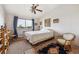 Cozy bedroom with natural light, plush carpet, and decorative rug and ceiling fan at 715 S Alton Way # 5D, Denver, CO 80247