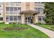 Welcoming entrance to 715 S Alton Way, enhanced by a beautiful flower bed and well-maintained landscaping at 715 S Alton Way # 5D, Denver, CO 80247