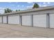 Row of garages in a well maintained property with fresh paint and blacktop at 715 S Alton Way # 5D, Denver, CO 80247