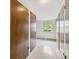 Hallway view to a window, and several doors leading to rooms at 715 S Alton Way # 5D, Denver, CO 80247