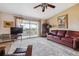 Inviting living room with a ceiling fan and balcony access at 715 S Alton Way # 5D, Denver, CO 80247