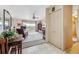 Open-concept living room with sliding glass doors leading to the balcony at 715 S Alton Way # 5D, Denver, CO 80247