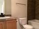 Bathroom with a toilet, vanity, and shower-tub combo at 11947 Riverstone Cir # 7F, Henderson, CO 80640