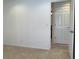 Bedroom with neutral walls, beige carpet and white door at 11947 Riverstone Cir # 7F, Henderson, CO 80640