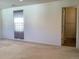 Bedroom with beige carpet, natural light, and door to the bathroom at 11947 Riverstone Cir # 7F, Henderson, CO 80640