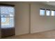 Bedroom with a decorative window with a decorative curtain and beige carpet at 11947 Riverstone Cir # 7F, Henderson, CO 80640