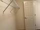 Walk-in closet with wire shelving and a door at 11947 Riverstone Cir # 7F, Henderson, CO 80640