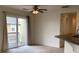 Cozy dining area with a ceiling fan, balcony access, and neutral walls, ideal for intimate gatherings at 11947 Riverstone Cir # 7F, Henderson, CO 80640
