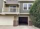 Townhouse with a balcony above the garage entrance, adding outdoor space to the property at 11947 Riverstone Cir # 7F, Henderson, CO 80640