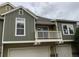 Close-up of a townhouse with a balcony and garage, showing an attractive facade and ample outdoor space at 11947 Riverstone Cir # 7F, Henderson, CO 80640