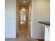 Hallway with neutral walls and doors to other rooms at 11947 Riverstone Cir # 7F, Henderson, CO 80640