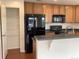 Kitchen featuring modern stainless steel appliances, light wood cabinetry and pantry at 11947 Riverstone Cir # 7F, Henderson, CO 80640