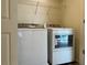 Laundry room with stacked washer and dryer at 11947 Riverstone Cir # 7F, Henderson, CO 80640