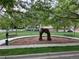 Park area with an art installation, trees, and green space at 11947 Riverstone Cir # 7F, Henderson, CO 80640