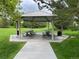 Community pavilion with picnic tables and trash receptacles at 11947 Riverstone Cir # 7F, Henderson, CO 80640