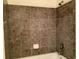 Shower featuring neutral tile at 11947 Riverstone Cir # 7F, Henderson, CO 80640