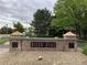 A decorative brick sign marks the entrance to River Oaks, enhancing the community's appeal and identity at 11947 Riverstone Cir # 7F, Henderson, CO 80640