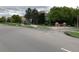 Street view with a sign for River Oaks, indicating the neighborhood's attractive location and community features at 11947 Riverstone Cir # 7F, Henderson, CO 80640