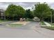 Street view featuring the River Oaks sign, highlighting the community's location and well-maintained surroundings at 11947 Riverstone Cir # 7F, Henderson, CO 80640
