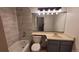 Stylish bathroom with modern fixtures, tiled shower, and ample counter space at 1818 S Quebec Way # 5-7, Denver, CO 80231