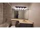 Updated bathroom featuring stylish fixtures, a new toilet, and modern tile work at 1818 S Quebec Way # 5-7, Denver, CO 80231