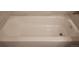 A pristine, white bathtub showcasing its clean and smooth surface at 1818 S Quebec Way # 5-7, Denver, CO 80231