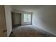 Bright bedroom with large closet, neutral paint, and new carpet at 1818 S Quebec Way # 5-7, Denver, CO 80231