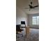 Bedroom featuring large window with lots of natural light, a ceiling fan, and neutral carpet at 1818 S Quebec Way # 5-7, Denver, CO 80231
