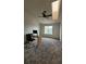 Cozy bedroom with ceiling fan, natural light, and neutral colored walls and carpet at 1818 S Quebec Way # 5-7, Denver, CO 80231