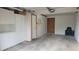 This garage features built-in cabinets, an interior door, and space for parking a vehicle at 1818 S Quebec Way # 5-7, Denver, CO 80231