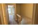 Well-lit hallway with carpeted floors, leading to a bedroom with natural light at 1818 S Quebec Way # 5-7, Denver, CO 80231